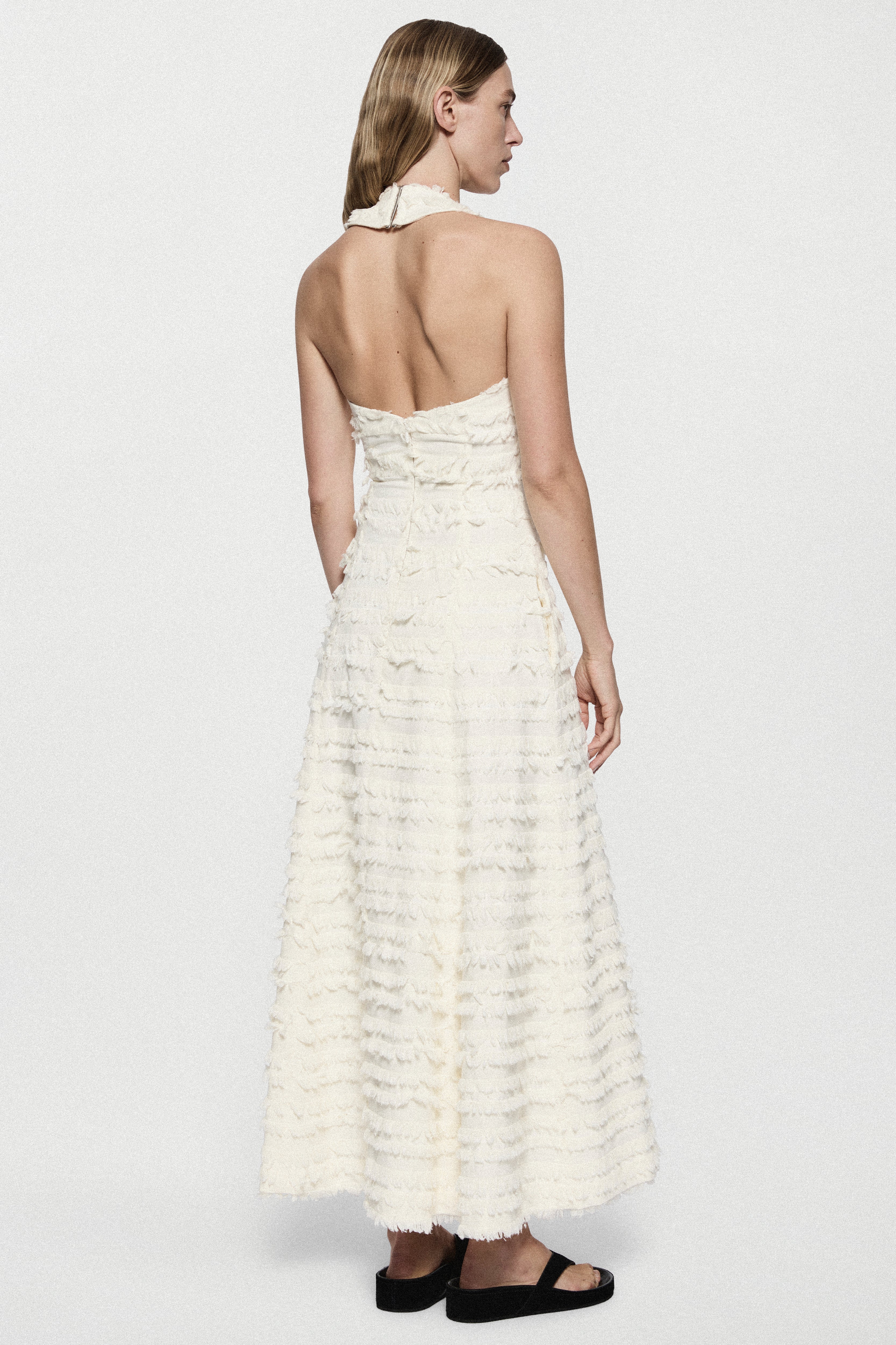 Winter white cotton fringe dress, sleeveless back view with open back