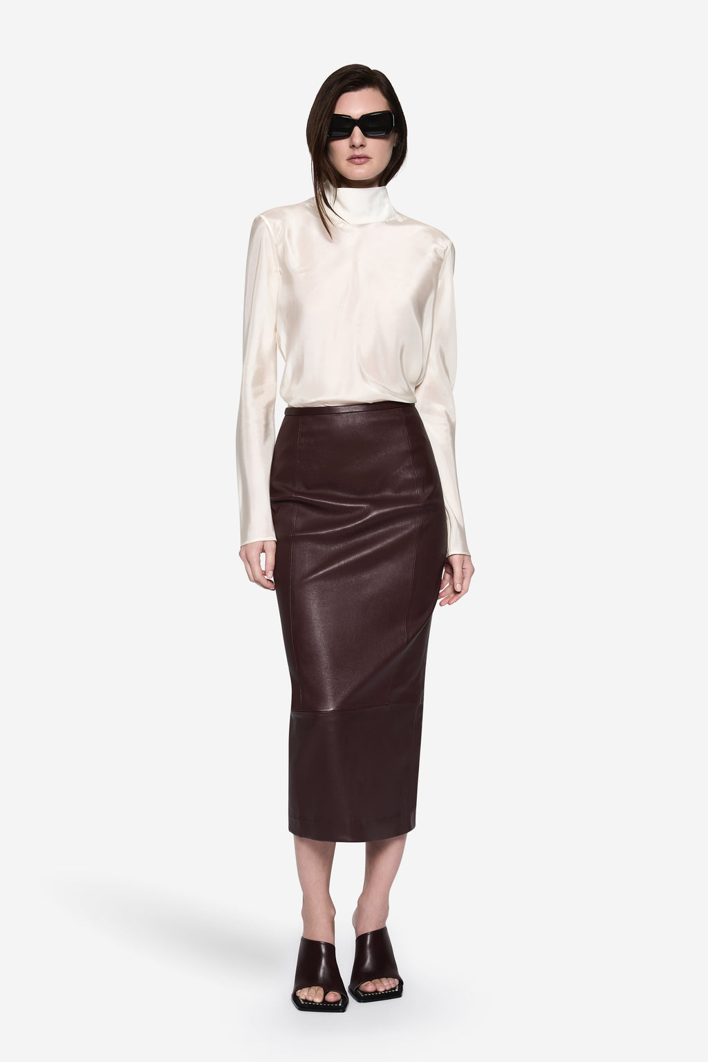 Ivory sheer silk blouse with high neck, long sleeves, and keyhole closure