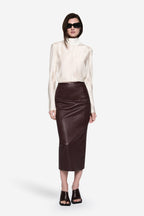 Ivory sheer silk blouse with high neck, long sleeves, and keyhole closure