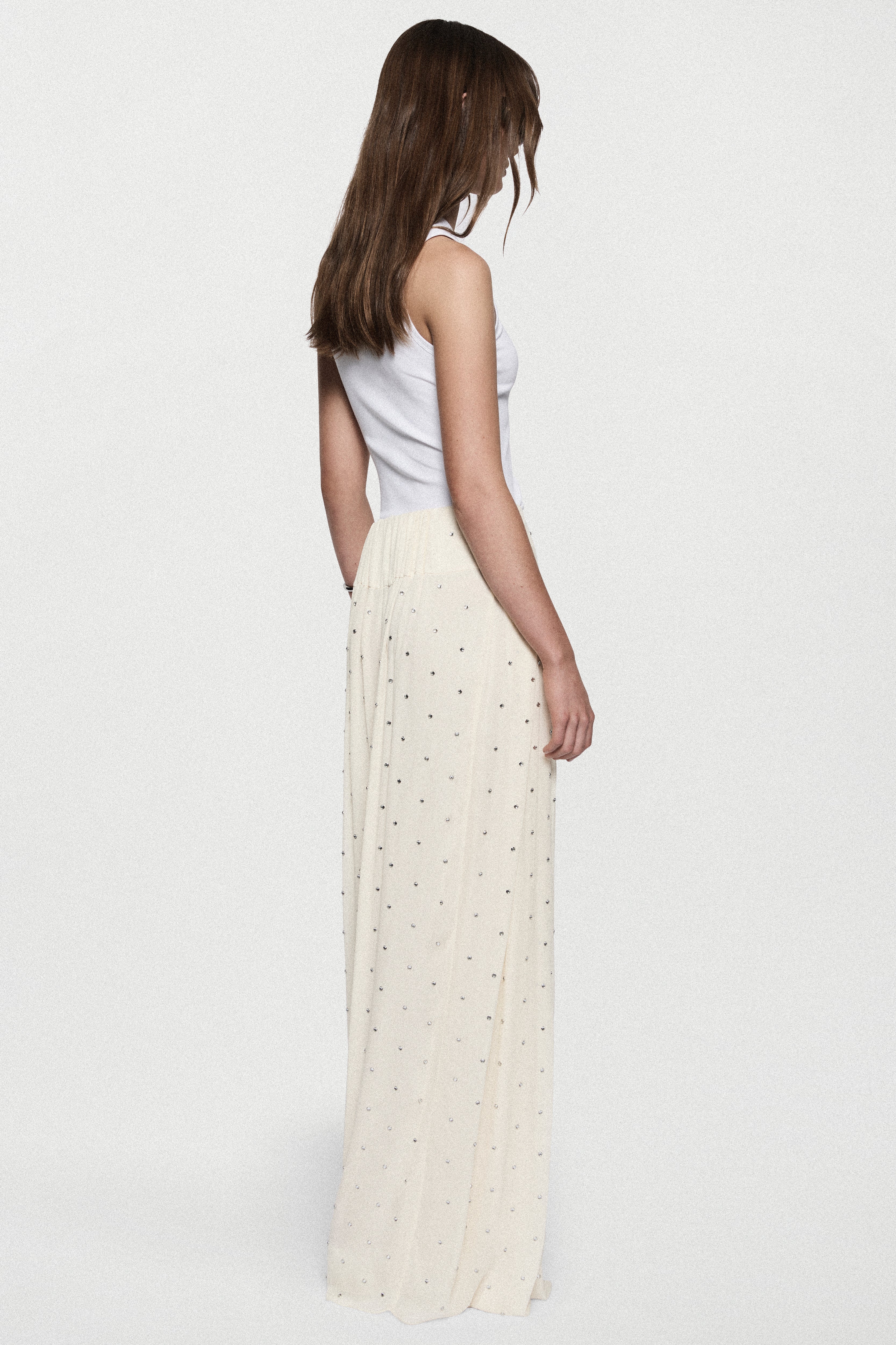 Winter white rhinestone palazzo pants viewed from back, high-rise wide legs