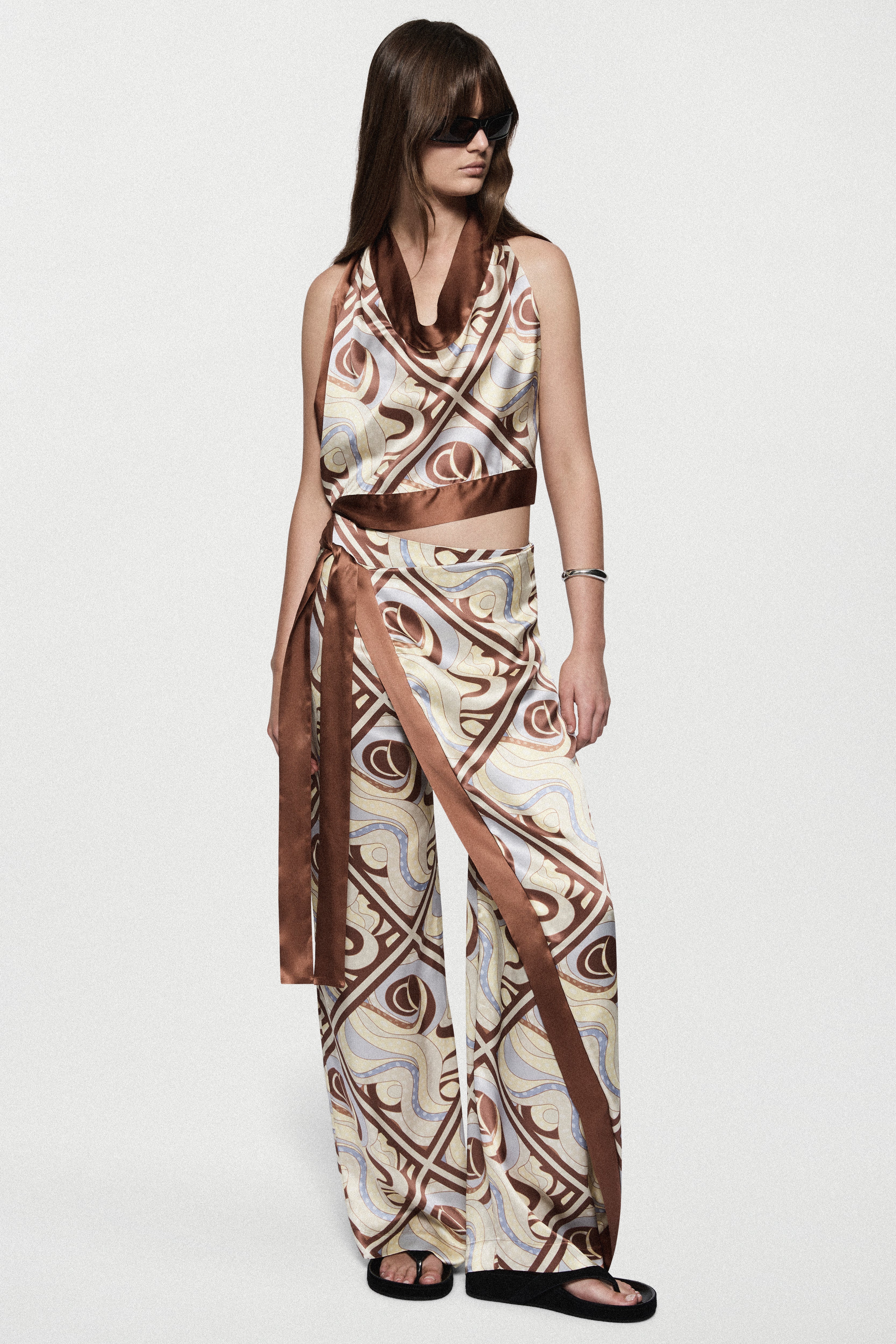 Silk trousers with LAGO swirl print, wide-leg and draped sash at waist