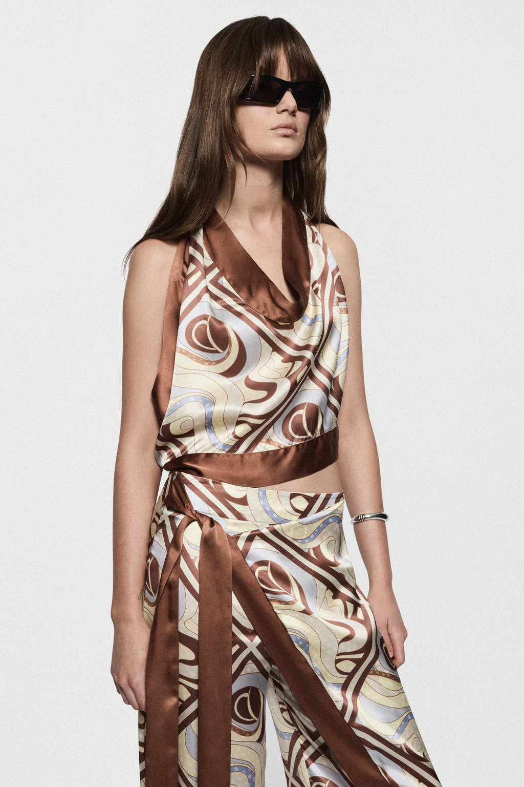 Printed silk halter top with draped cowl neckline, swirl print in brown and beige.