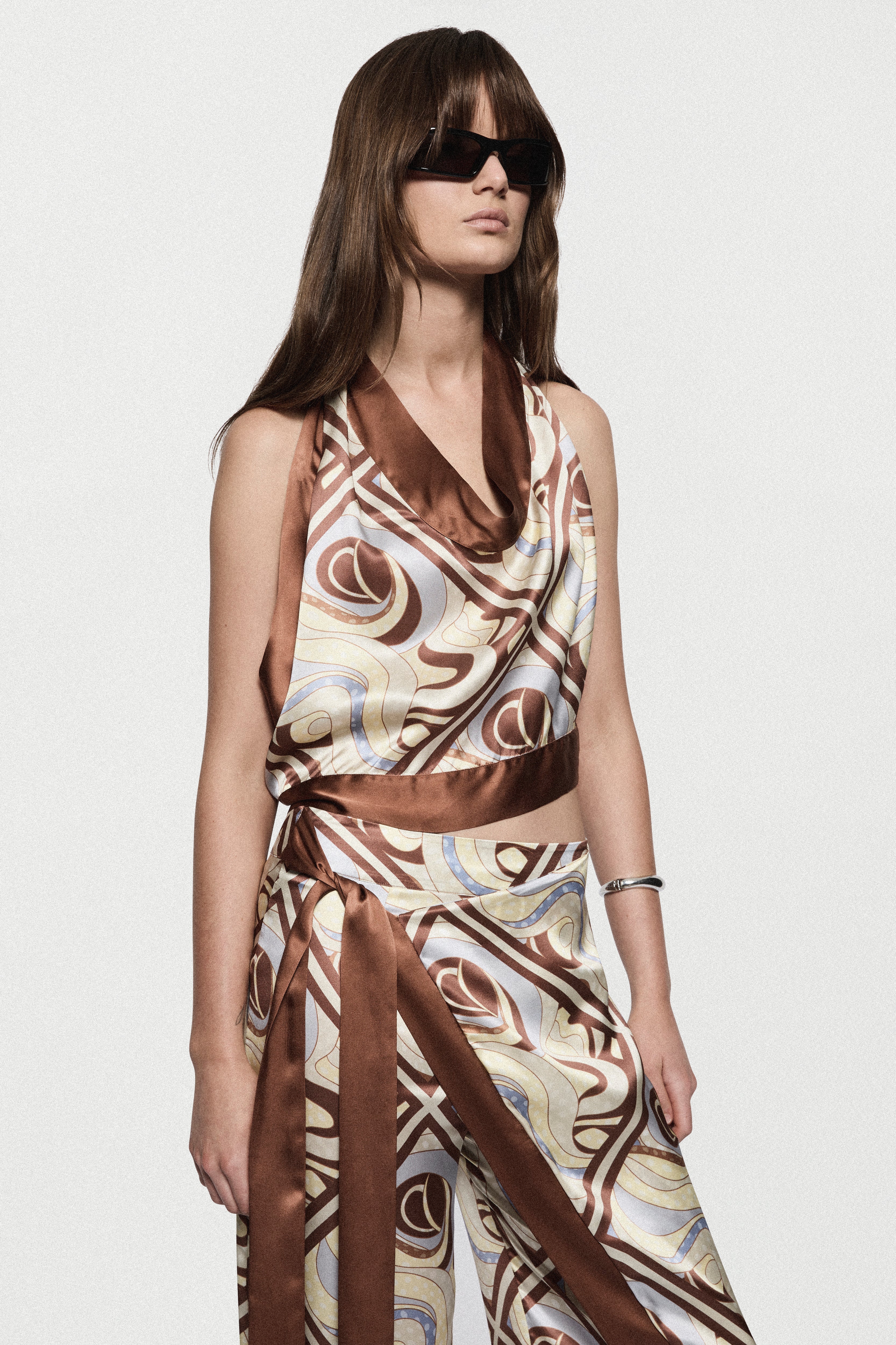 Printed silk halter top with draped cowl neckline, swirl print in brown and beige.