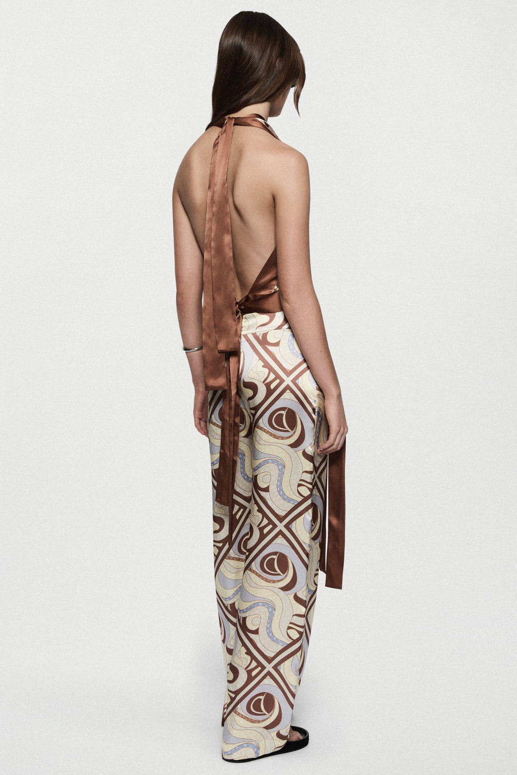 Silk trousers with LAGO swirl print, back view with long drape detail