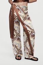 Silk trousers with LAGO swirl print, wide-leg cut with long side sash