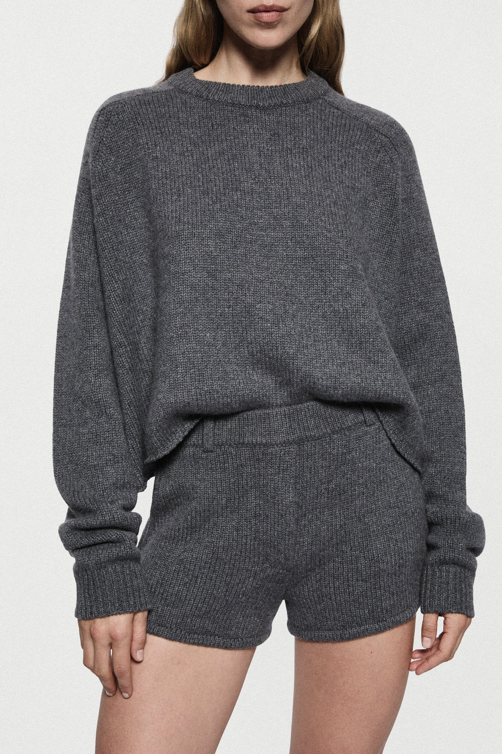 Charcoal cashmere mini knit shorts close-up with ribbed elastic waistband and hem
