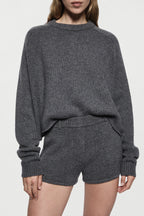 Charcoal cashmere mini knit shorts close-up with ribbed elastic waistband and hem