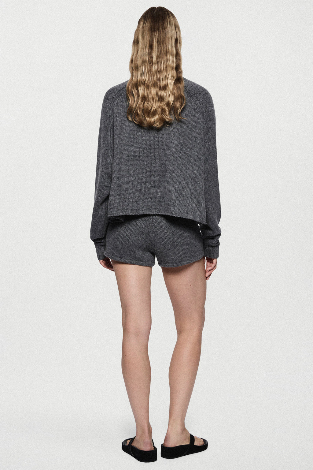 Charcoal cashmere mini knit shorts, back view, elastic waist and cuffed hem