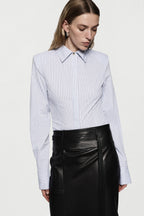 Light blue vertical striped fitted button-up shirt with pointed collar and long sleeves