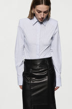 Black leather midi pencil skirt with high waistband and stitched front seam detail