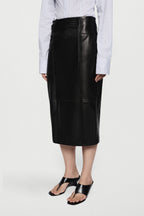 Black leather midi skirt with high waist, center seam, and smooth glossy finish