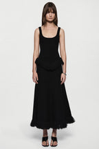 Black sleeveless top with square neckline and layered fringe hem
