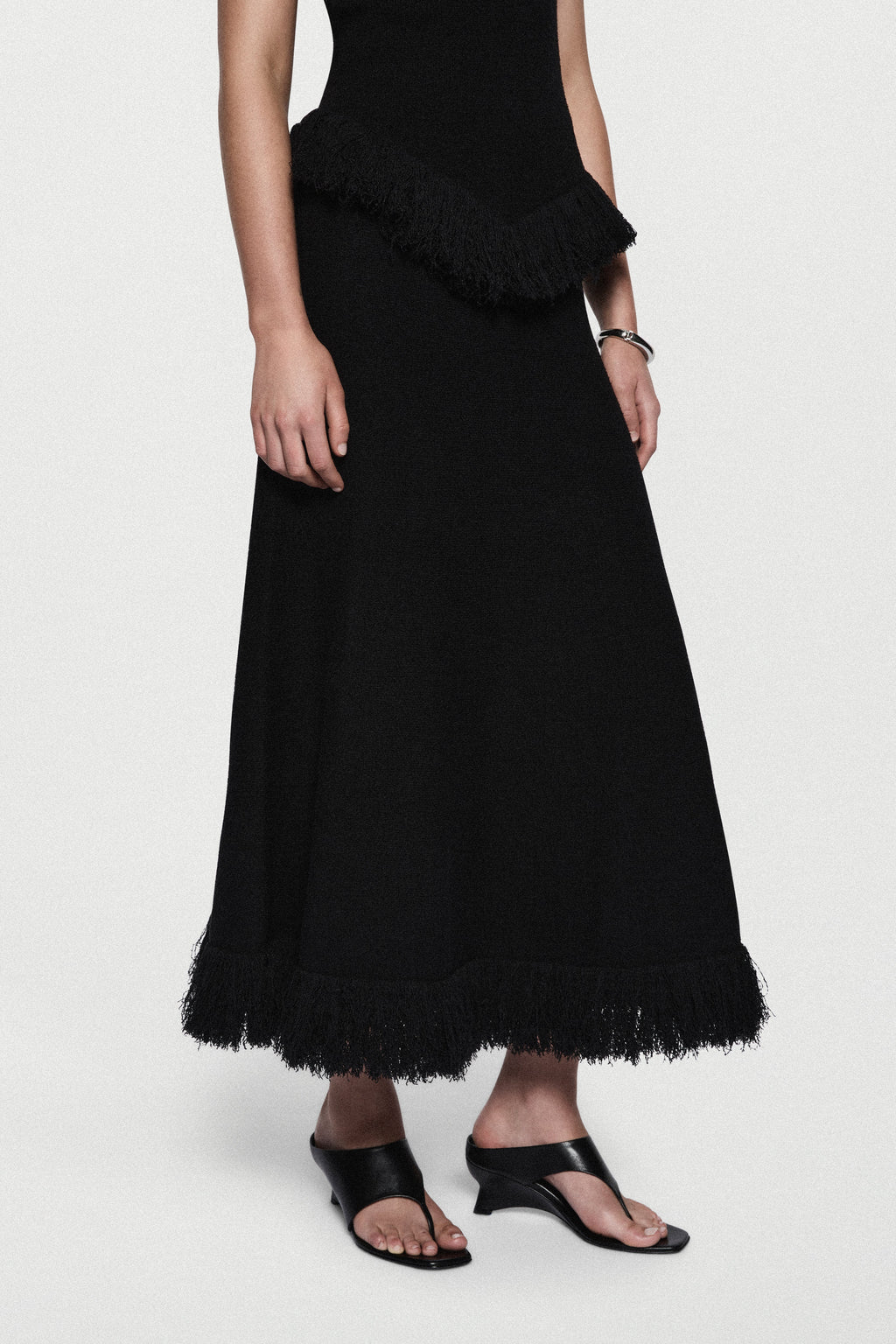 Black boucle midi skirt with layered fringe hem