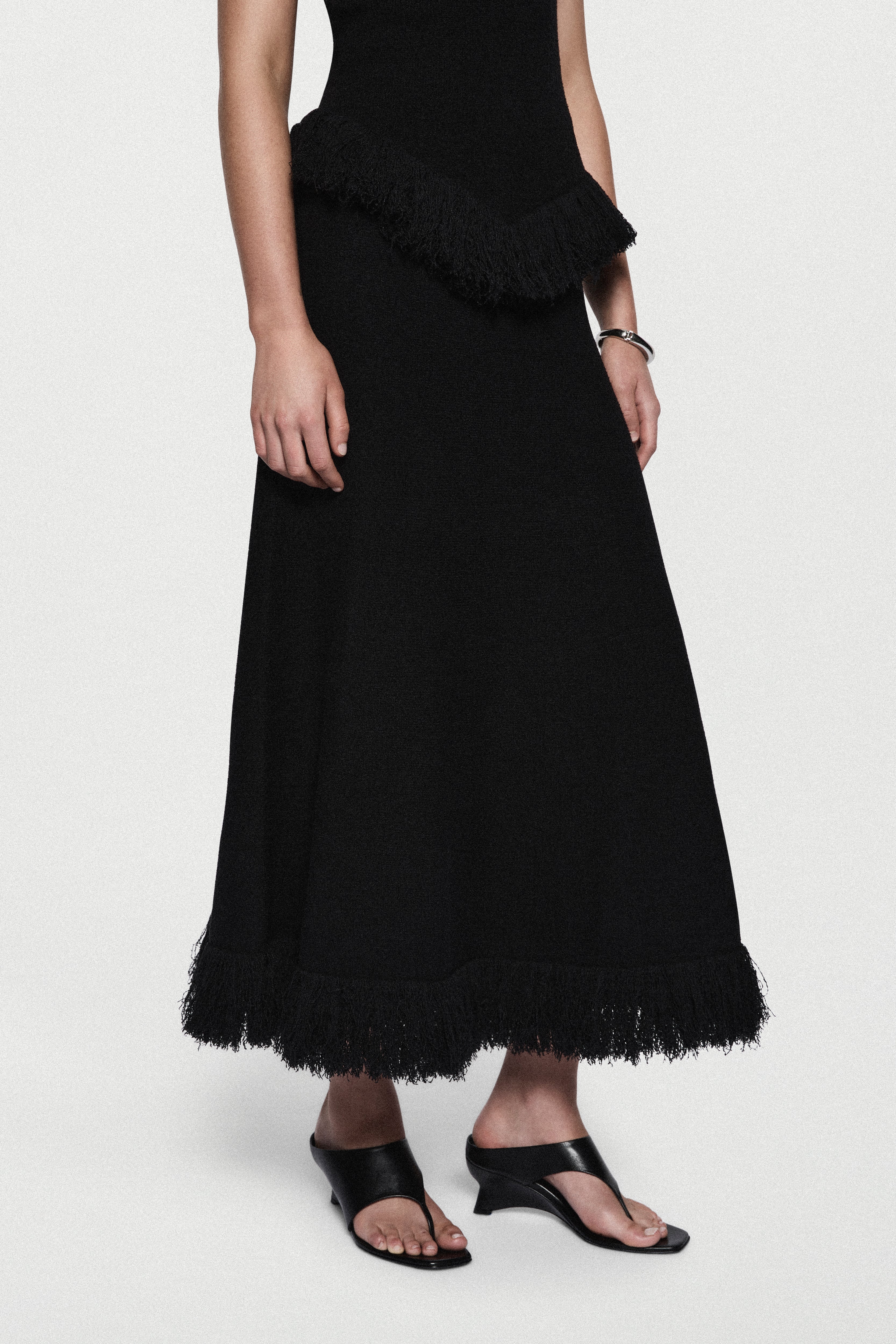 Black boucle midi skirt with layered fringe hem
