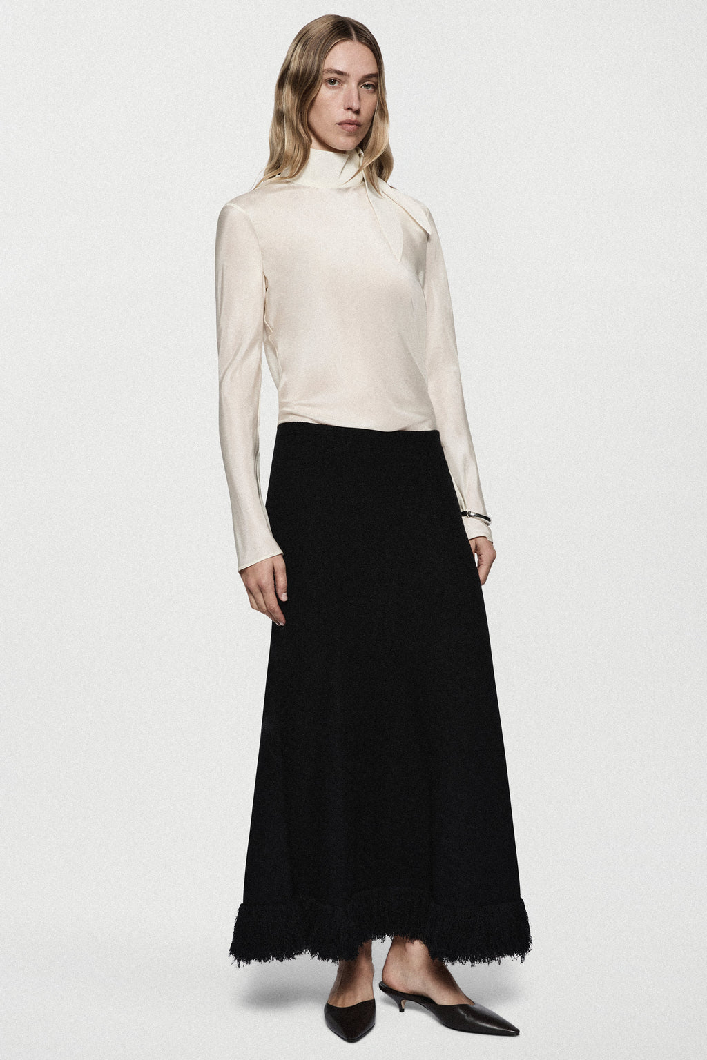Black boucle midi skirt with fringe edge and draped panels