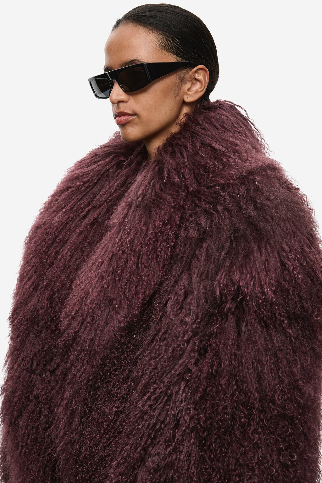 Maroon shearling jacket with thick fuzzy texture and oversized shawl collar