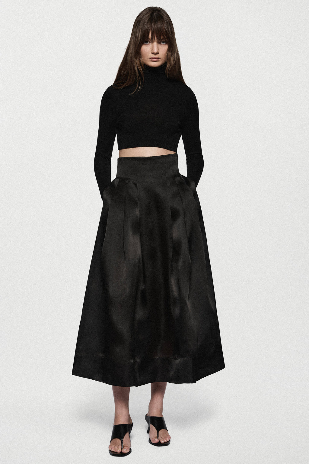 Black organza midi skirt with layered pleats and wide waistband