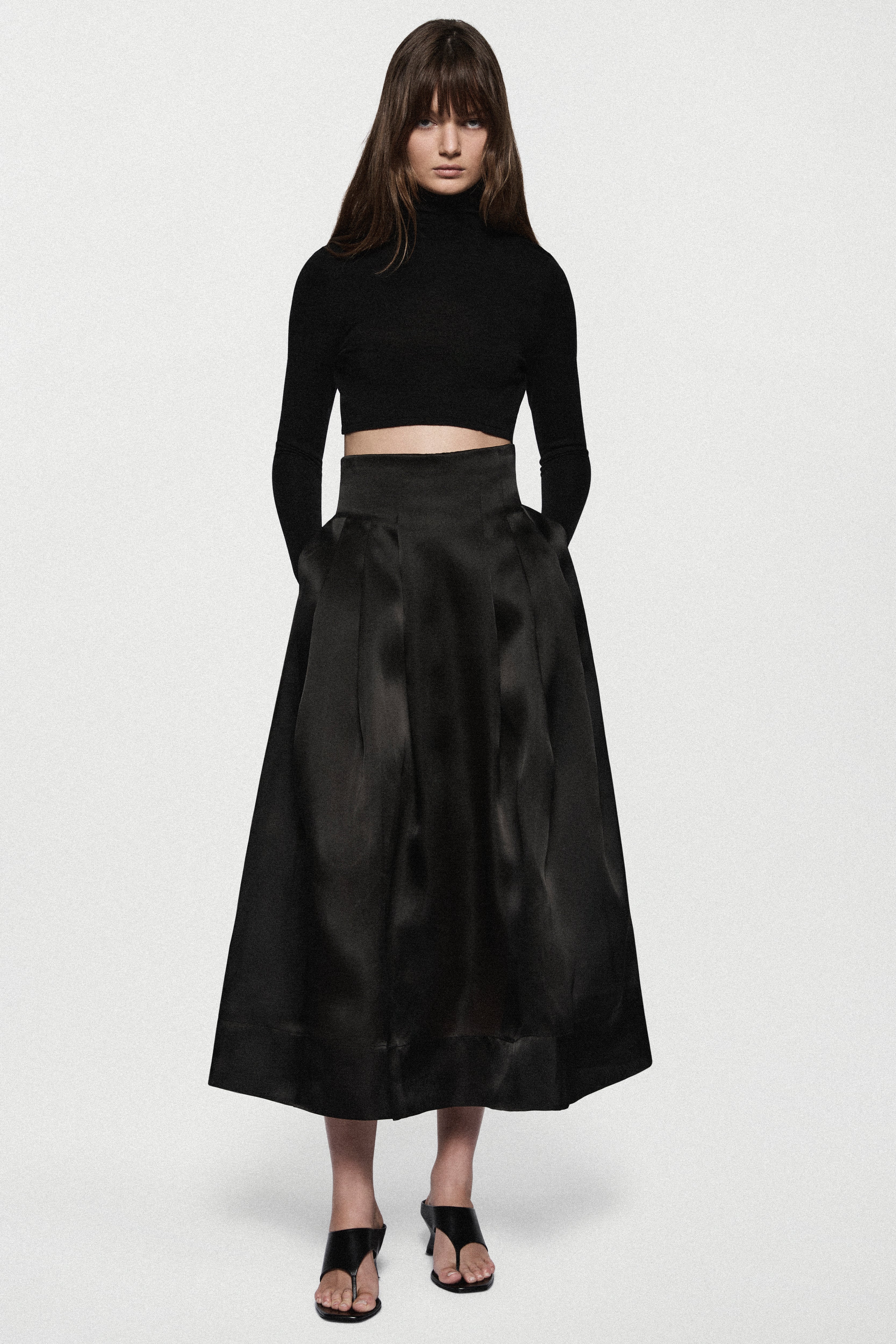 Black organza midi skirt with layered pleats and wide waistband