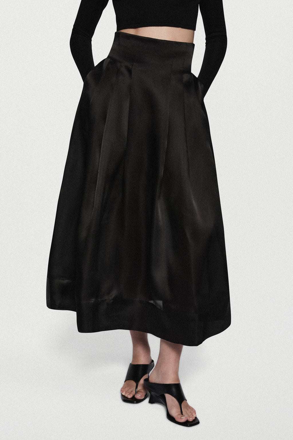 Black organza midi skirt with gathered pleats and flared hem