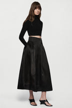 Black organza midi skirt with pleated A-line silhouette and elastic waistband
