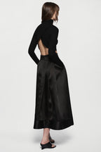 Black organza midi skirt, back view, gathered pleats and flared A-line fit