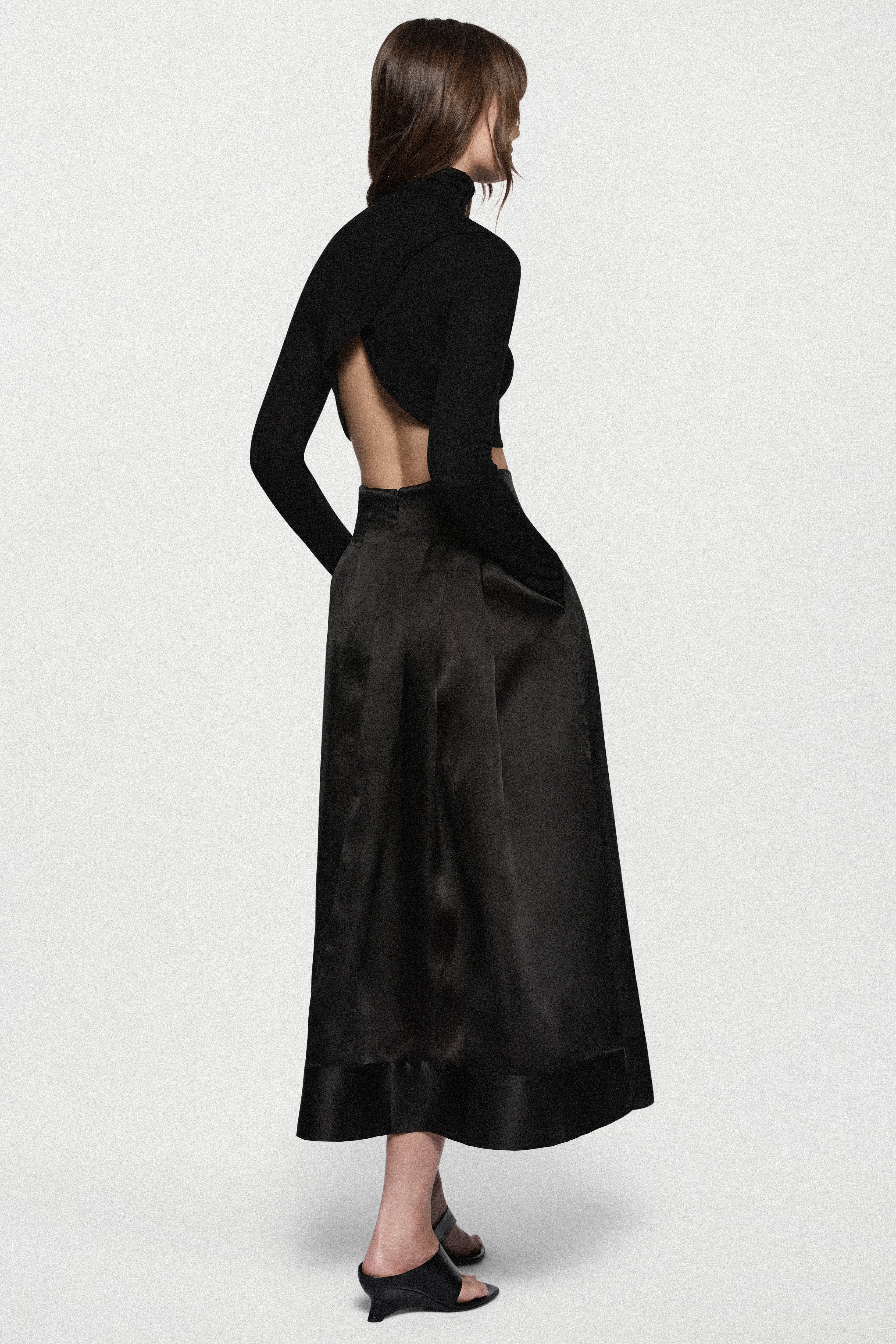 Black organza midi skirt, back view, gathered pleats and flared A-line fit