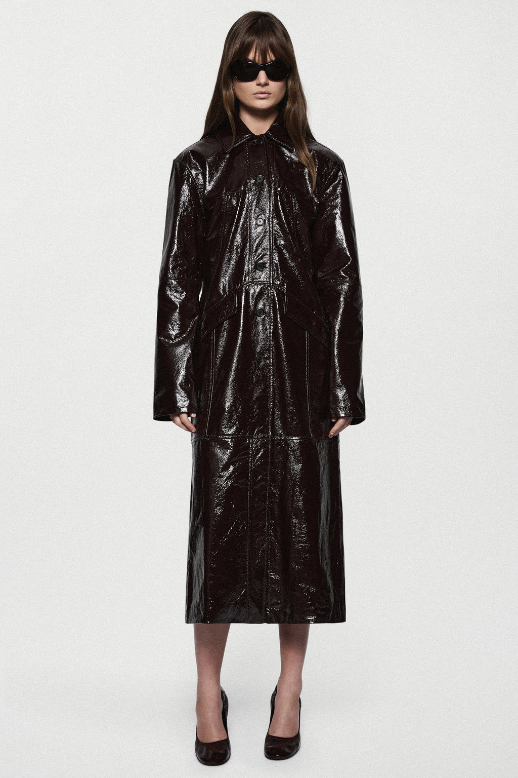 Bitter chocolate patent leather coat, long glossy design with button placket and cuffs