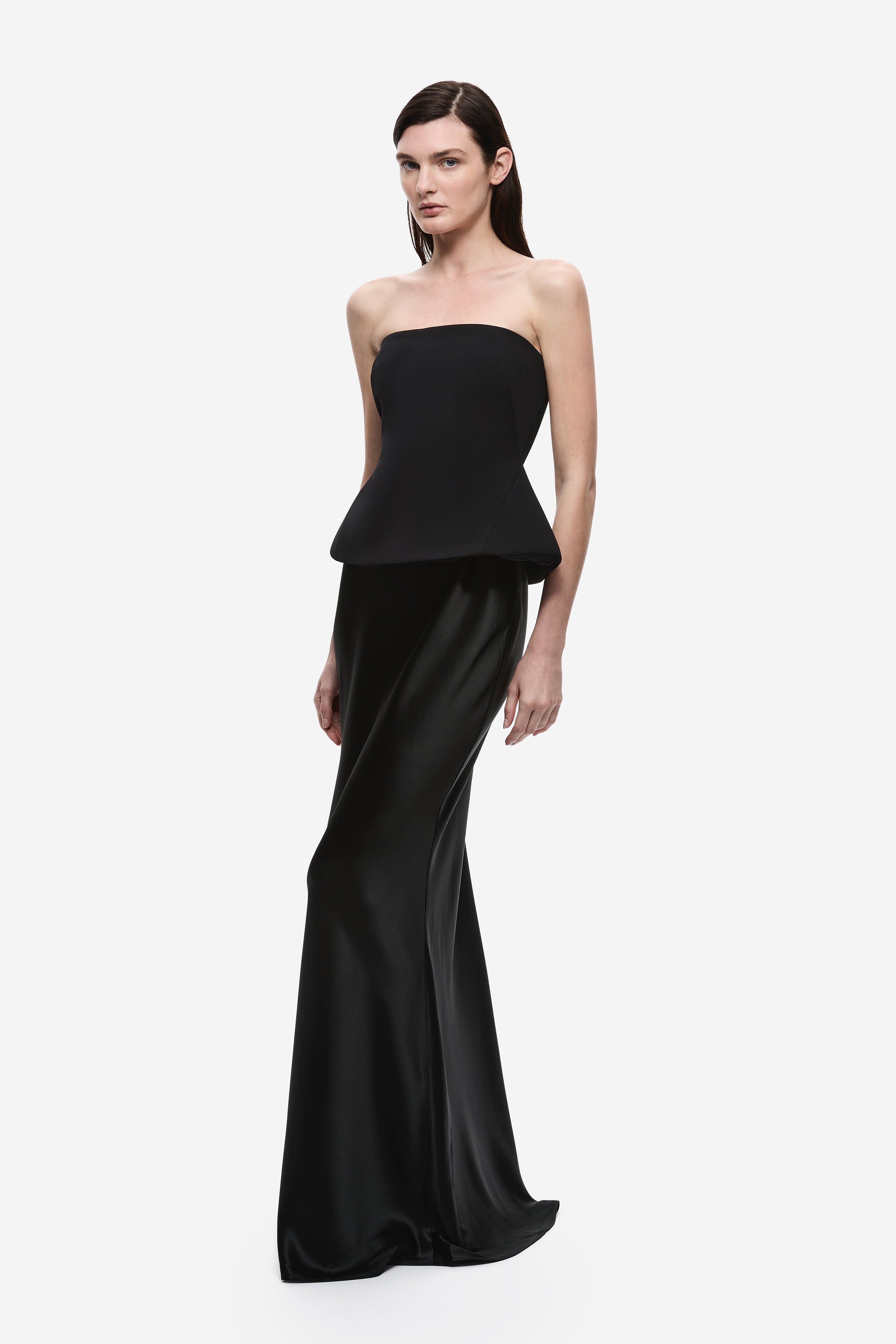 Black padded strapless satin gown with peplum waist and floor-length mermaid silhouette