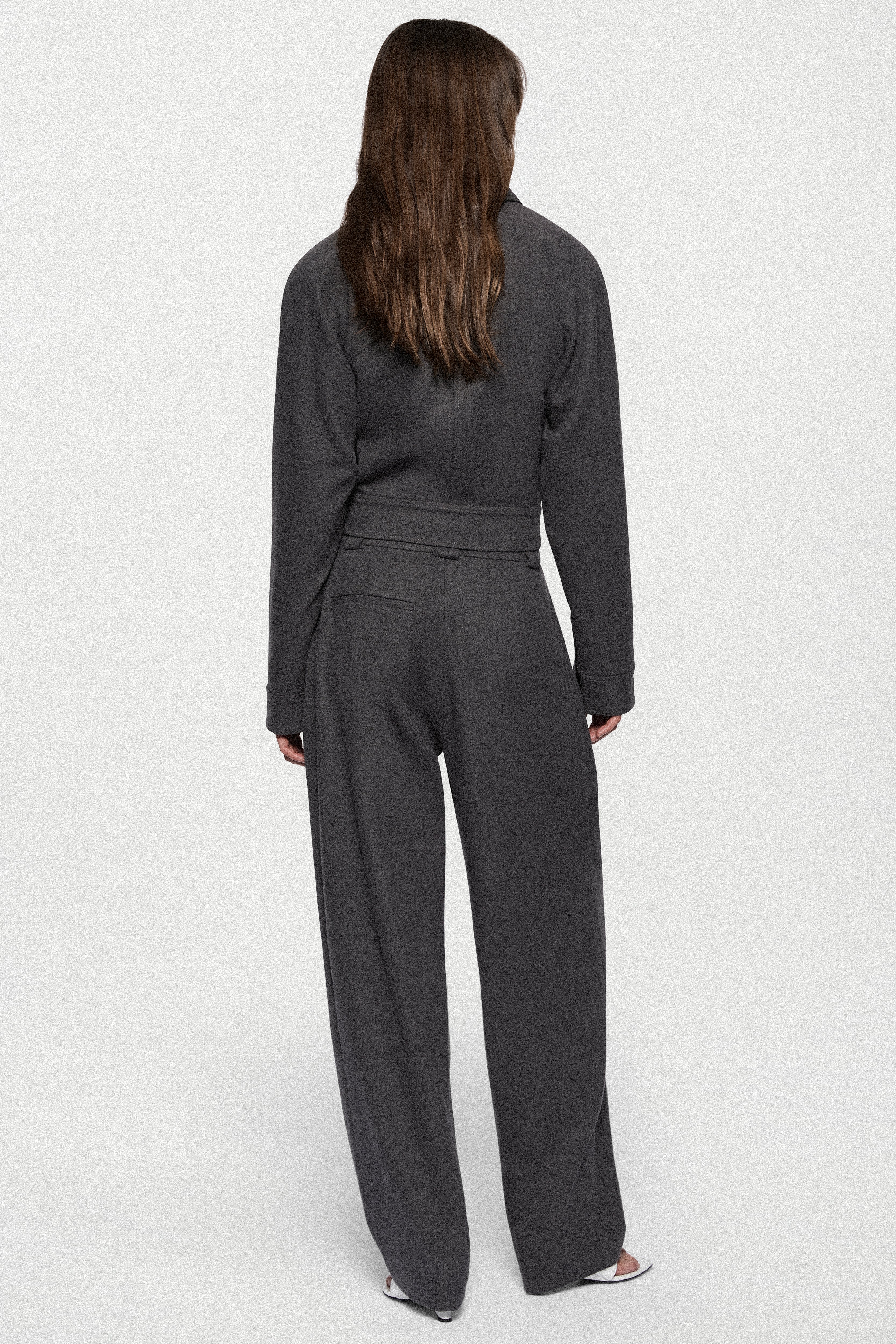 Charcoal tailored trousers, back view with center seam and relaxed wide-leg