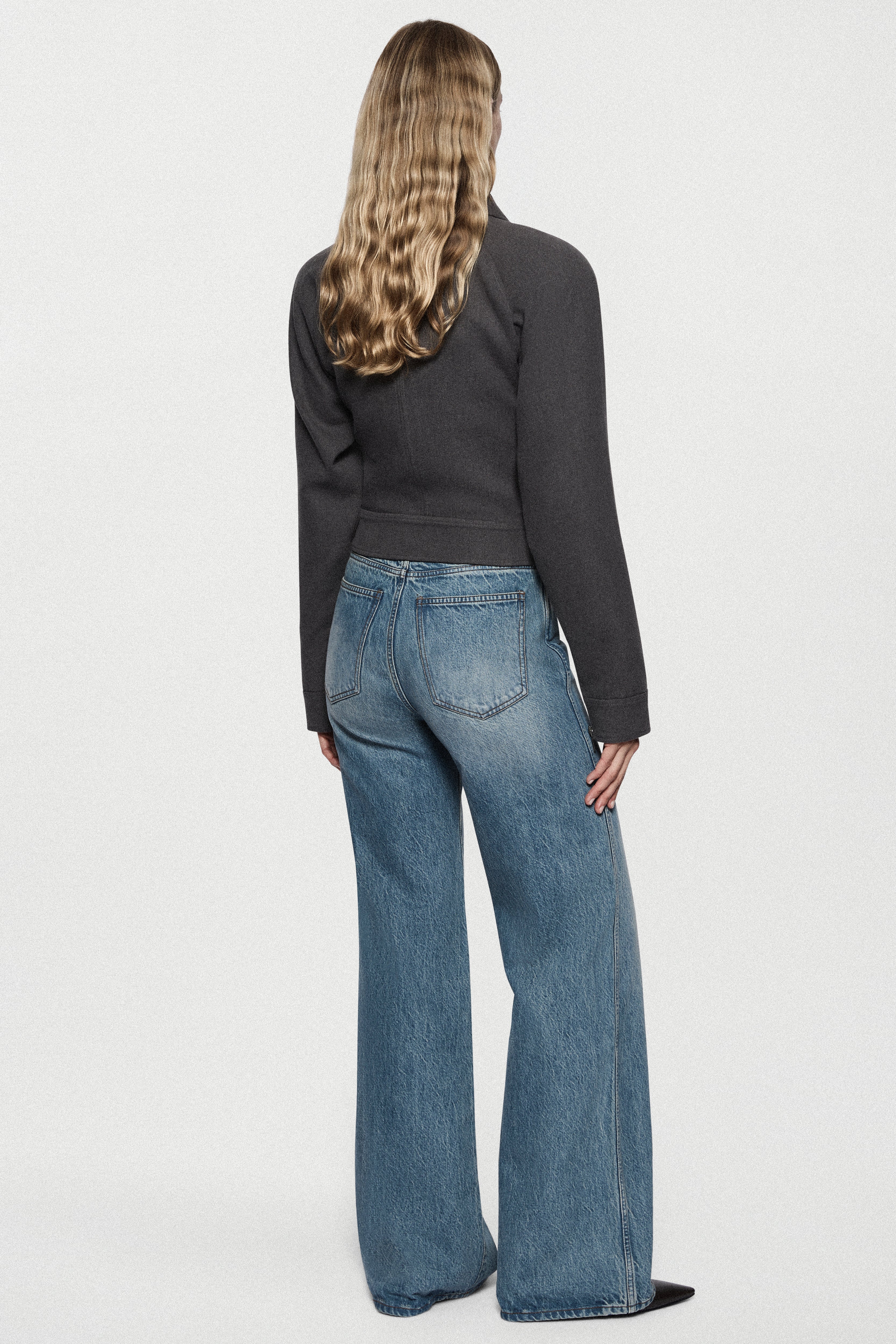 Charcoal tailored bomber jacket, back view with pointed collar and seam details