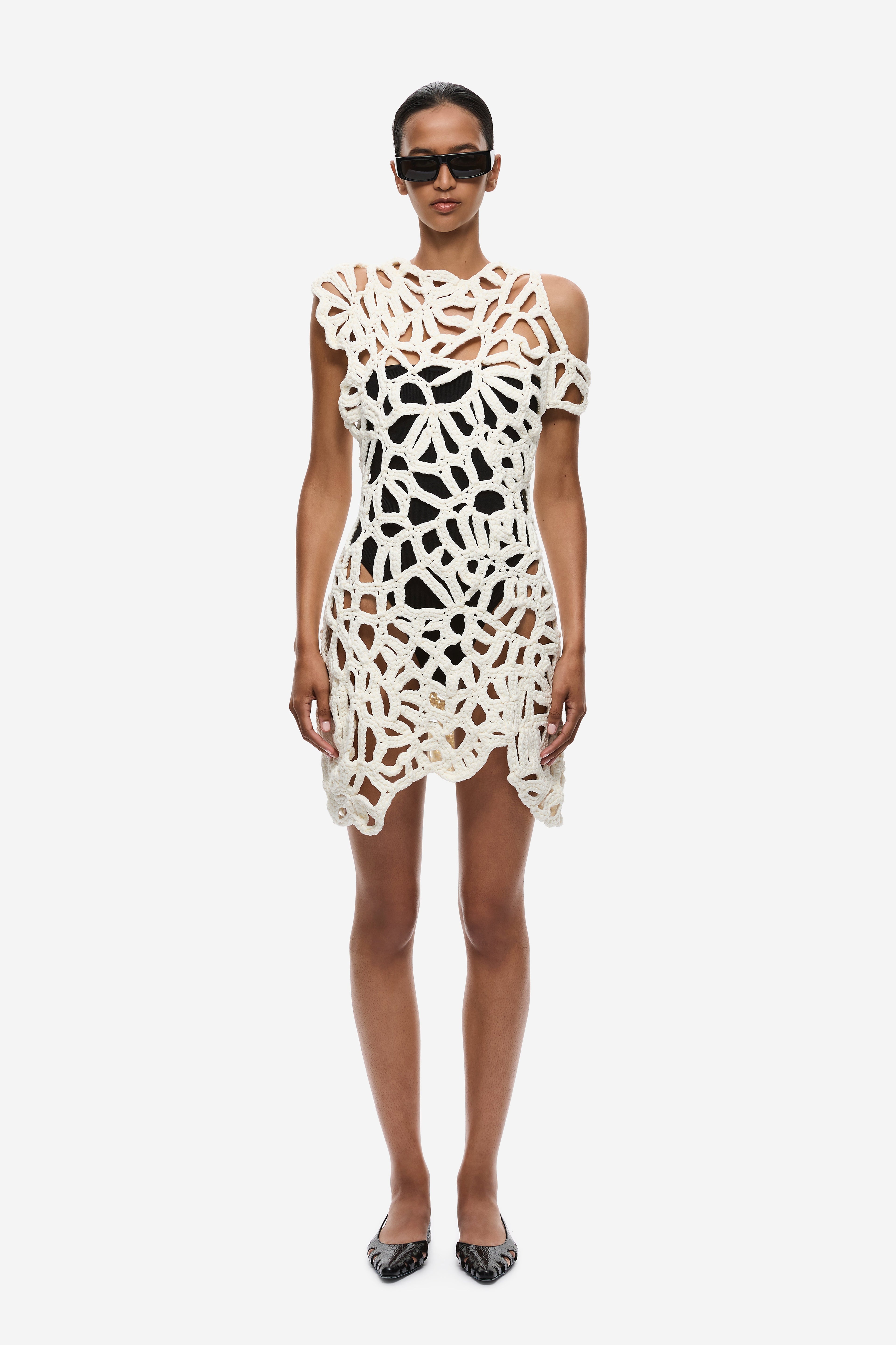 Ivory crochet mini dress with openwork lattice pattern and sleeveless cut