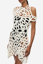 Ivory crochet mini dress bodice detail with bold openwork lattice and shoulder cutouts