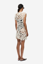 Ivory crochet mini dress with open back and sleeveless cut, crochet lattice pattern