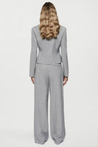 Melange grey wide-leg trousers, back view with seam detailing