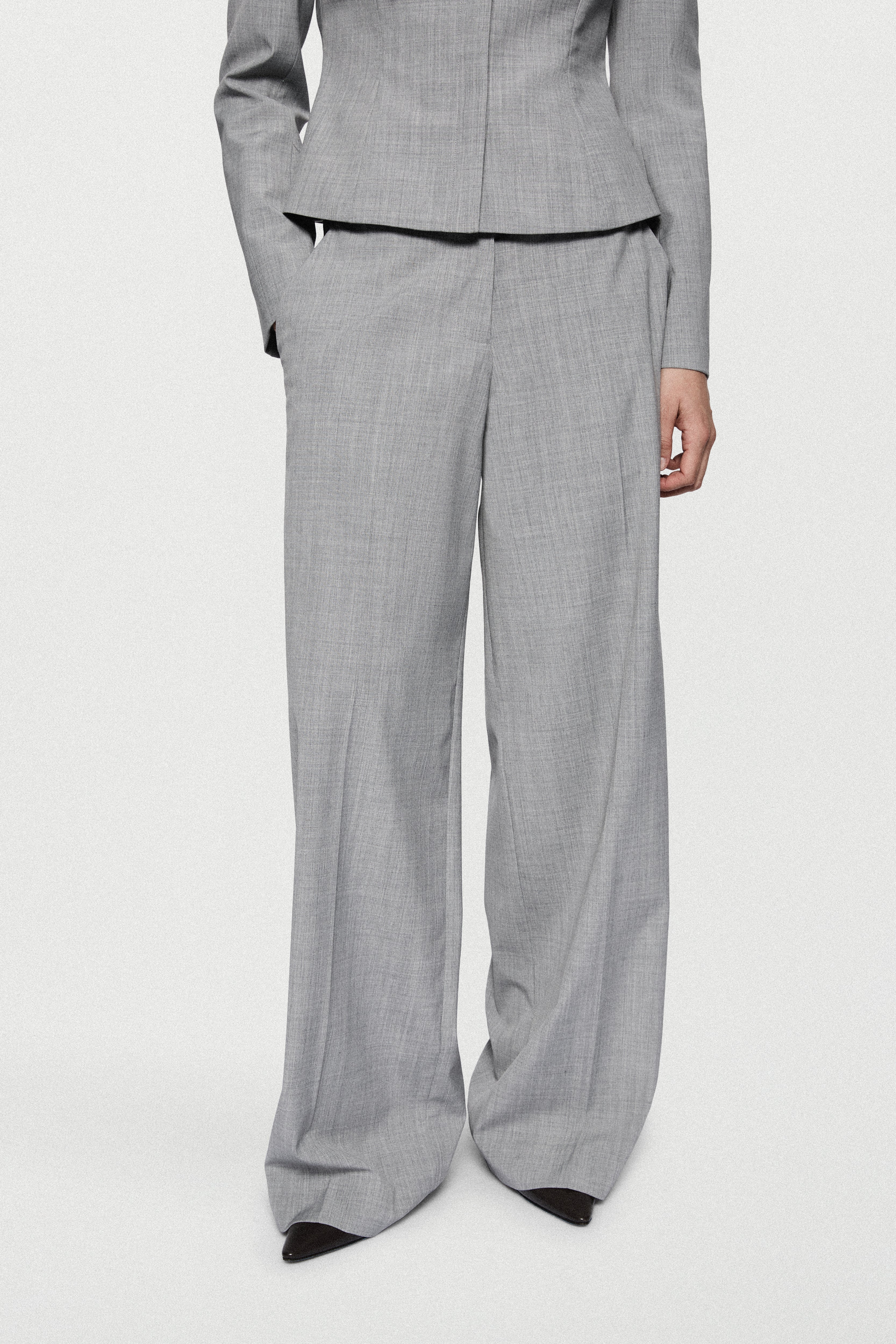 Melange grey wide-leg trousers with contrast piping, relaxed straight legs