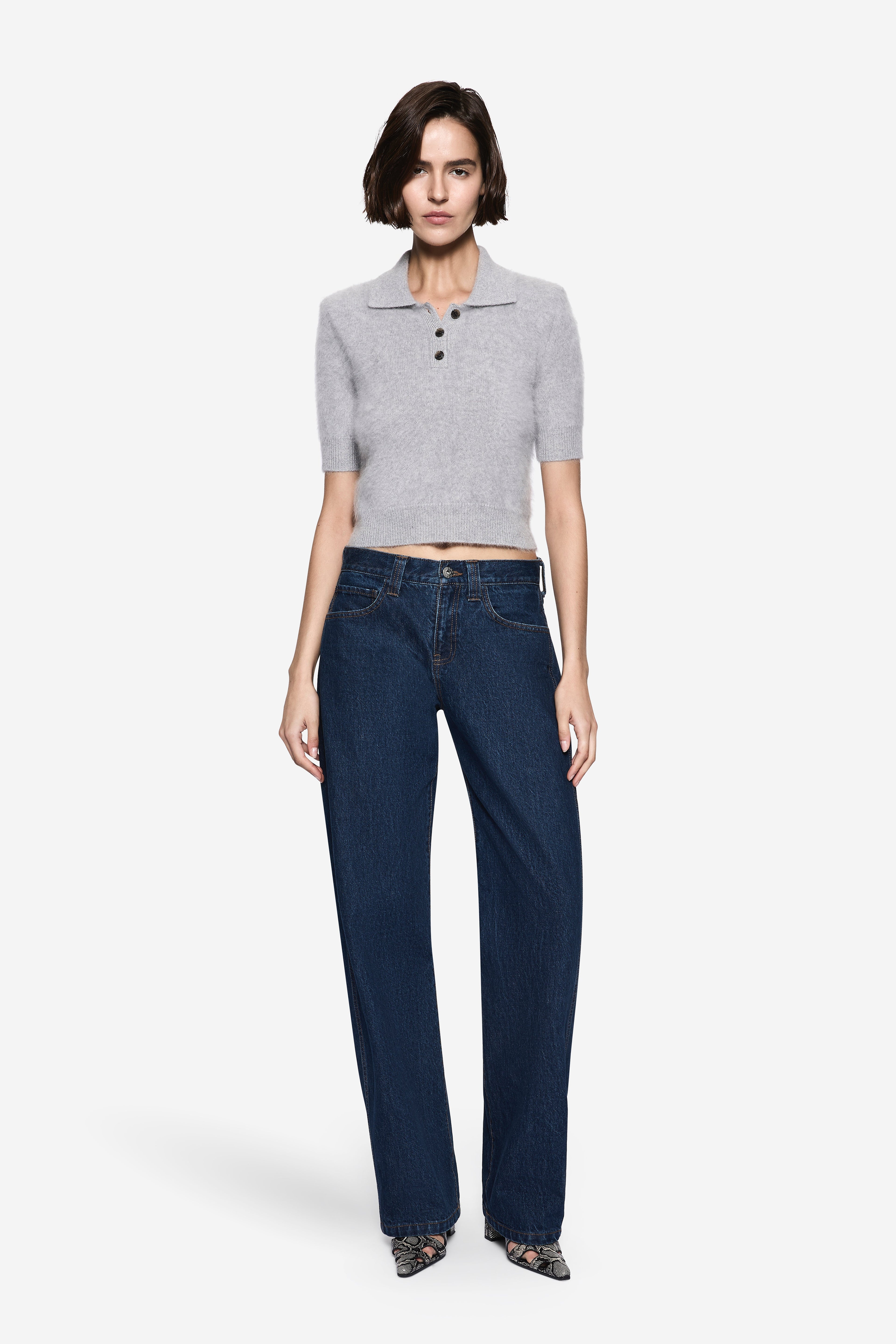 Light grey brushed cashmere polo with ribbed cuffs, three-button placket, short sleeves