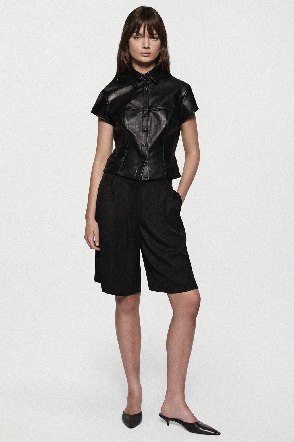 Black short-sleeve leather shirt with button front and collar