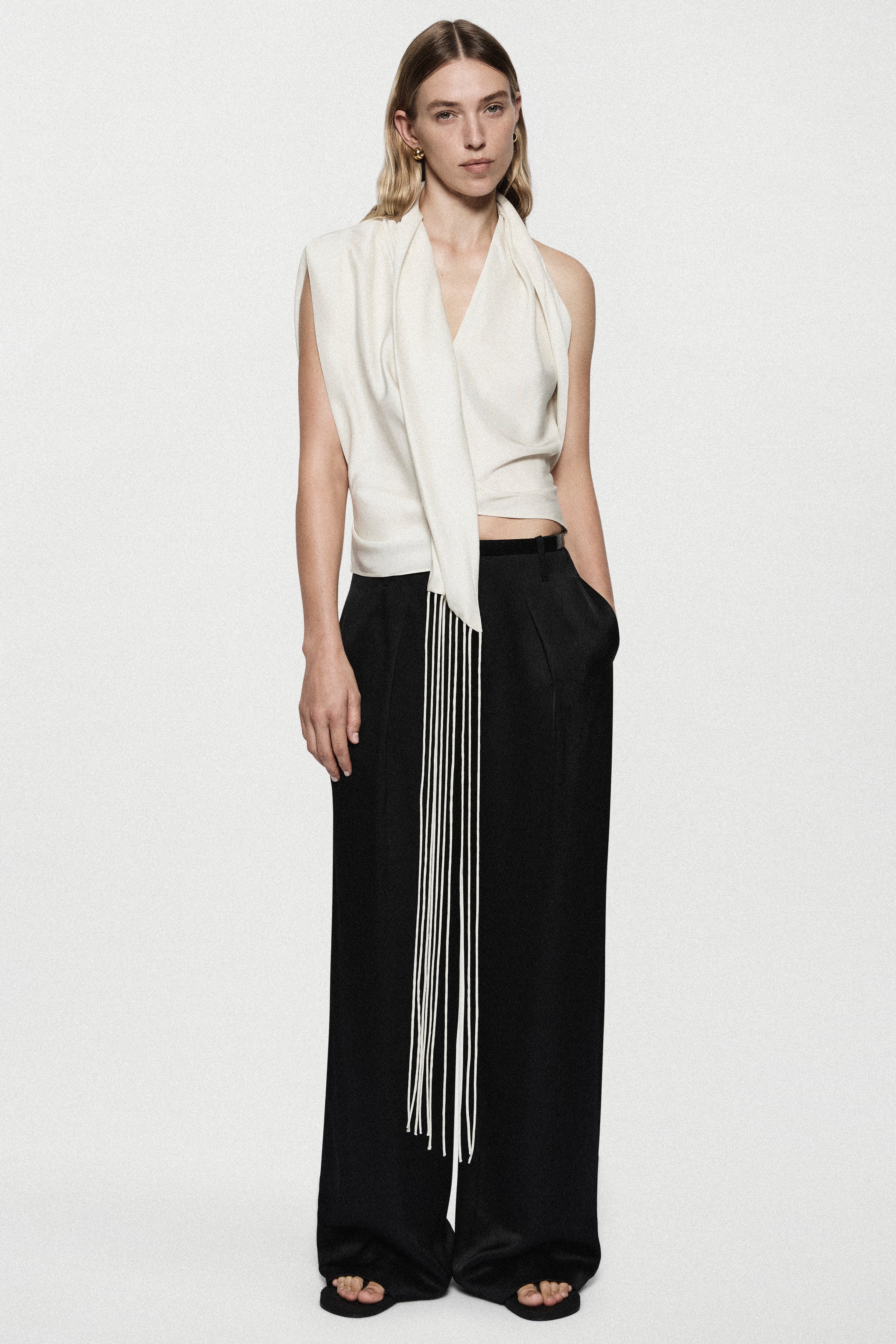 Winter white satin sleeveless V-neck top with front fringe panel