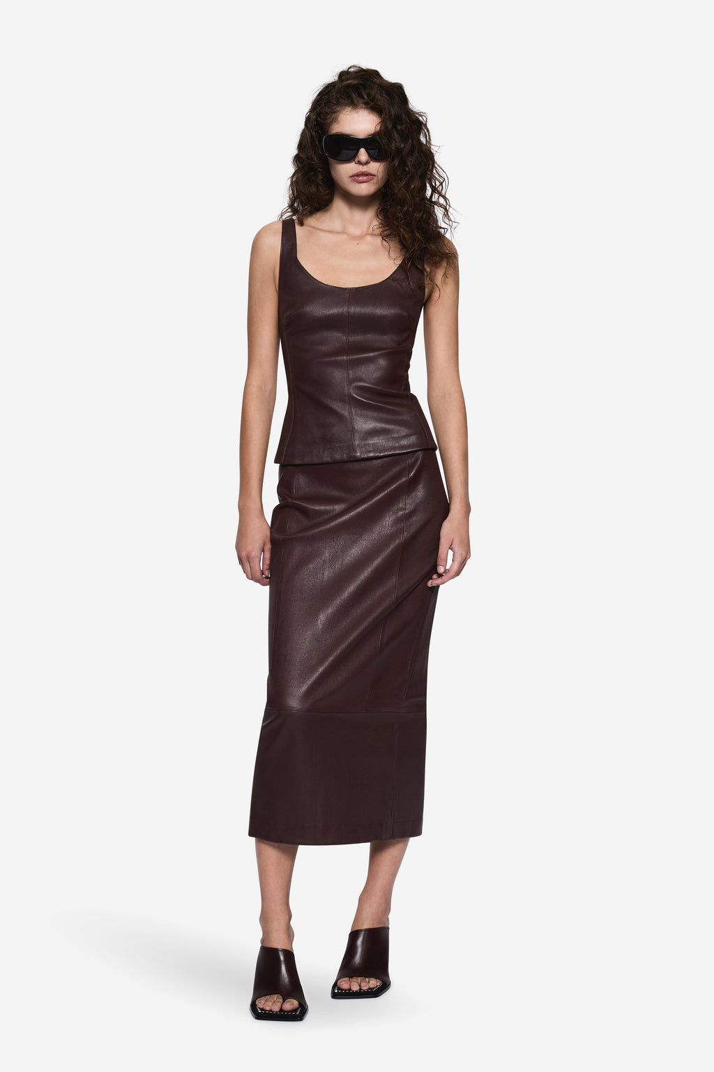 Dark brown sleeveless stretch leather top with scoop neckline and contoured fit