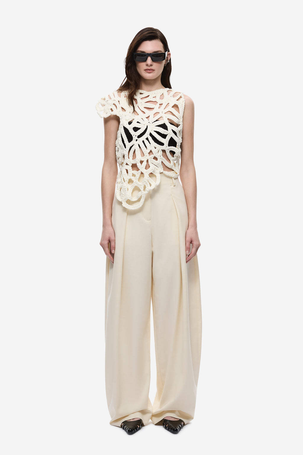 Ivory crochet top with openwork floral pattern and scalloped edges, cap sleeves