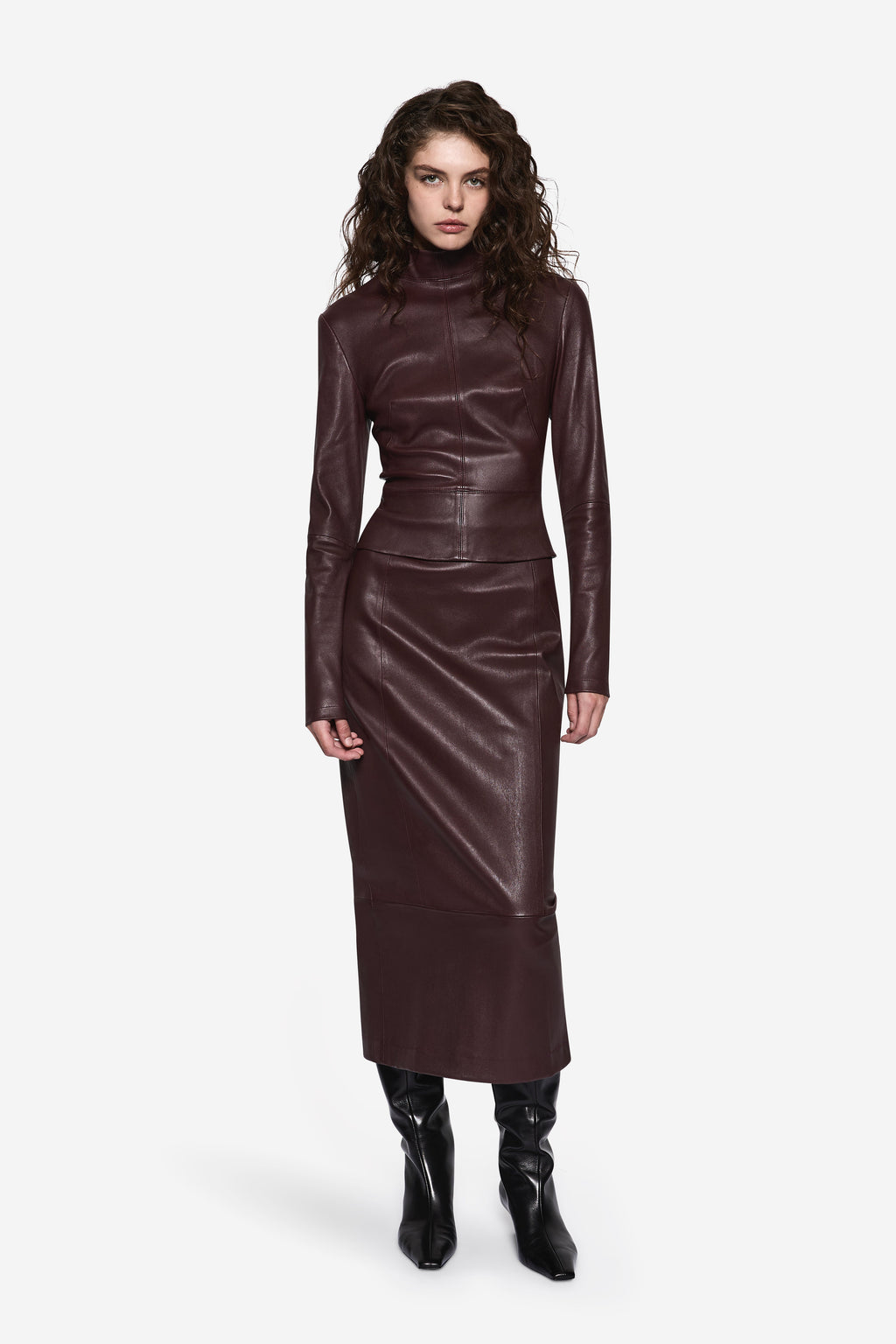 Bitter chocolate leather long-sleeve top with high neck and fitted peplum silhouette