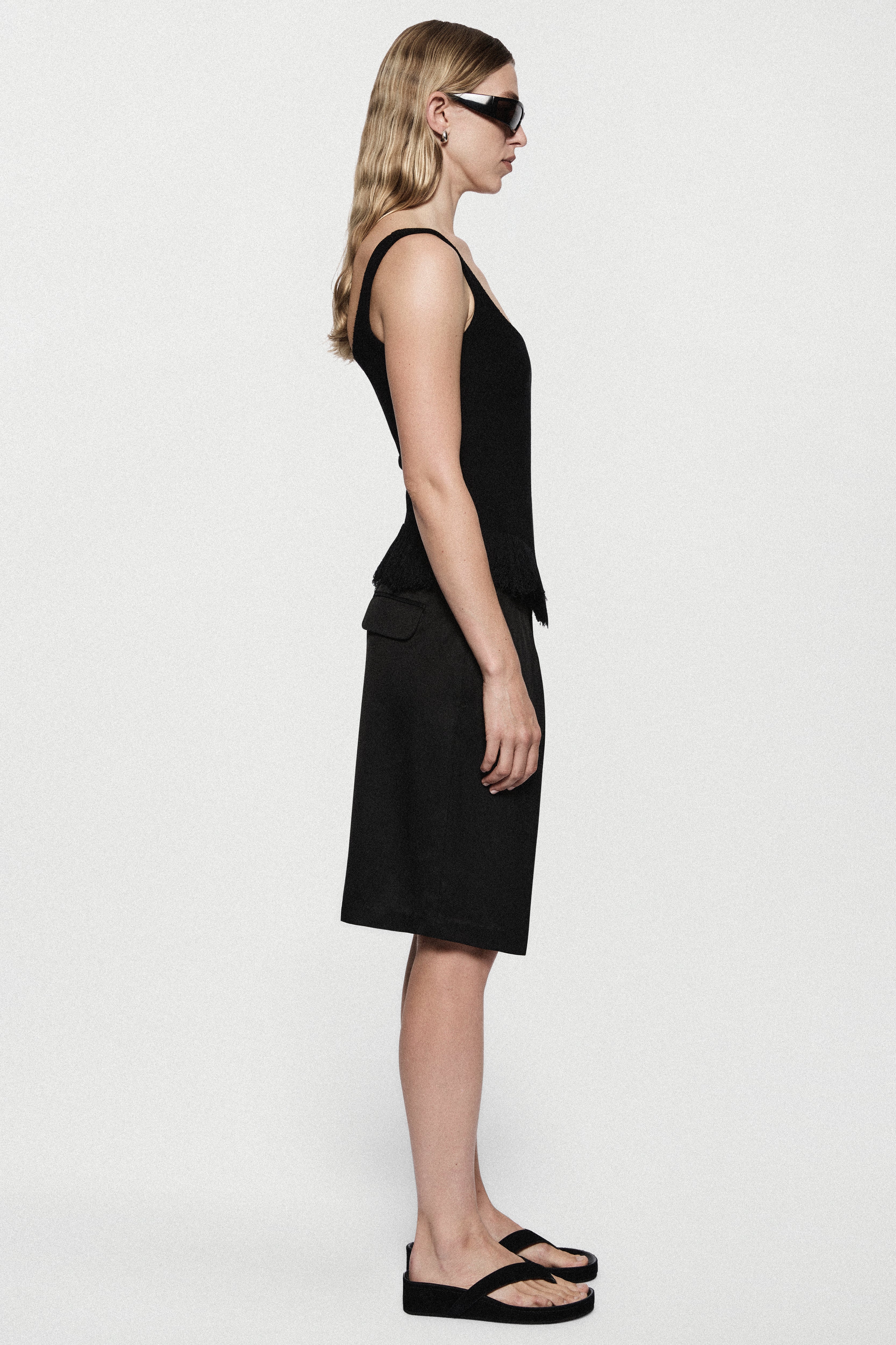 Black twill acetate shorts with straight legs and side pockets, above-knee length
