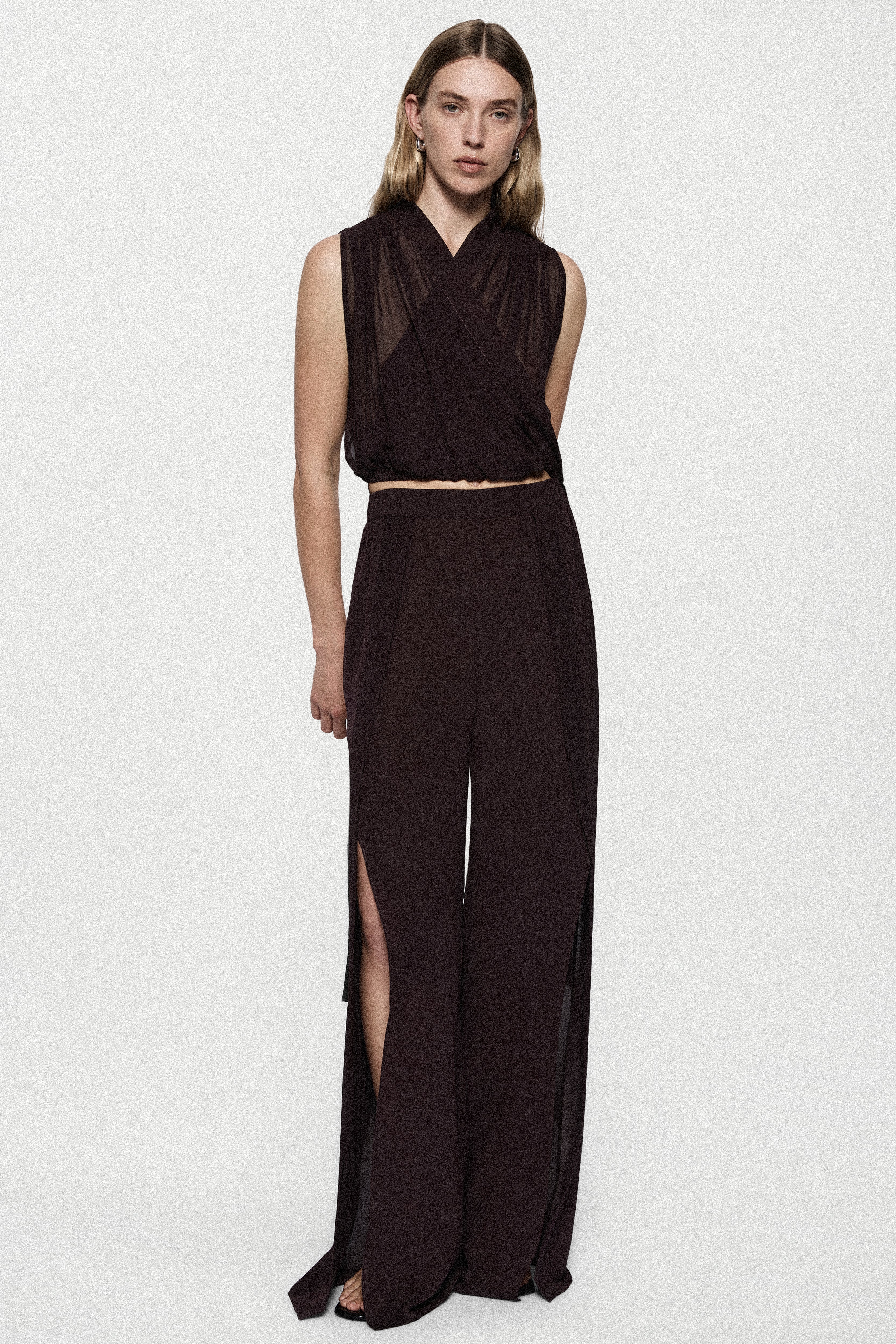Silk deep fig split-leg pants with sleeveless V-neck crossover top and tied waist