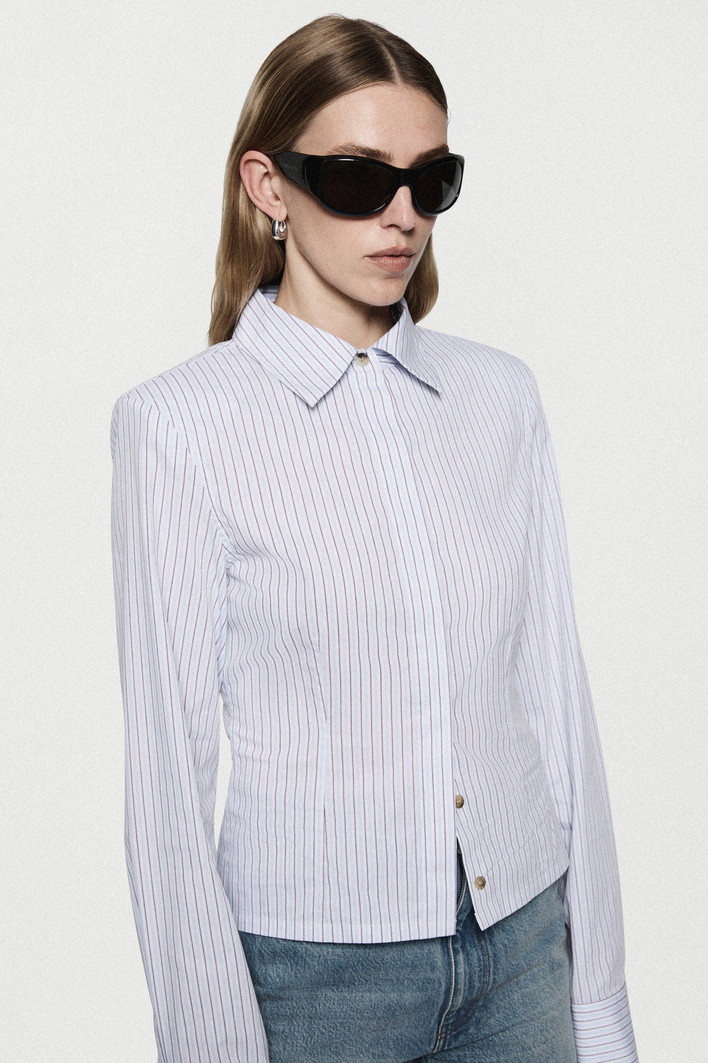 Light blue vertical striped fitted shirt with pointed collar and button cuffs