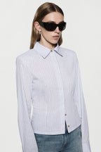 Light blue vertical striped fitted shirt with pointed collar and button cuffs