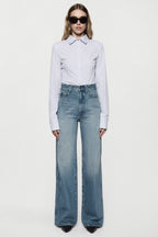 High-rise vintage wash wide-leg jeans with light-blue faded denim and front seams