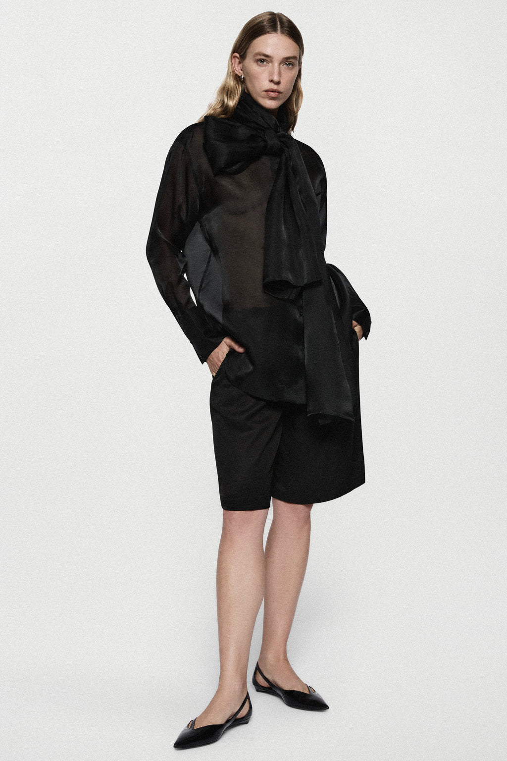 Black silk organza blouse with high neck bow tie and long sleeves