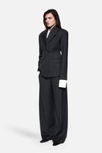 Charcoal pinstripe wool blazer with tailored button front and structured shoulder seams.