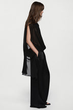 Black sheer sleeveless silk blouse with high neck and back tie detail