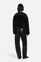 Black faux fur jacket with stand collar, back view